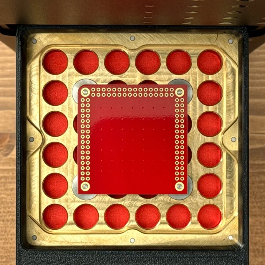 A ceramic two-sided PCB blank in the PewCB tray