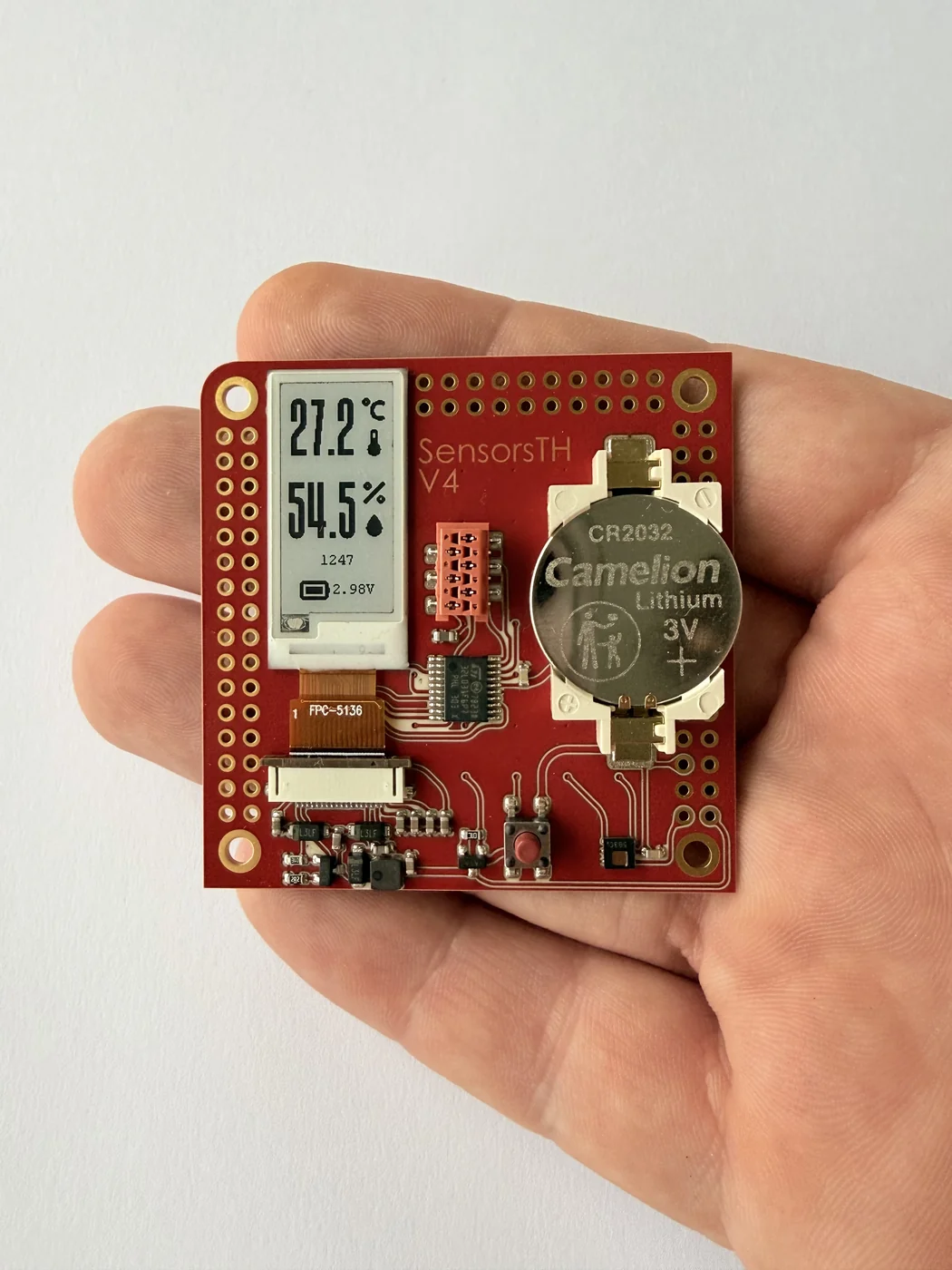 A compact working sensor prototype made with PewCB, held in one hand