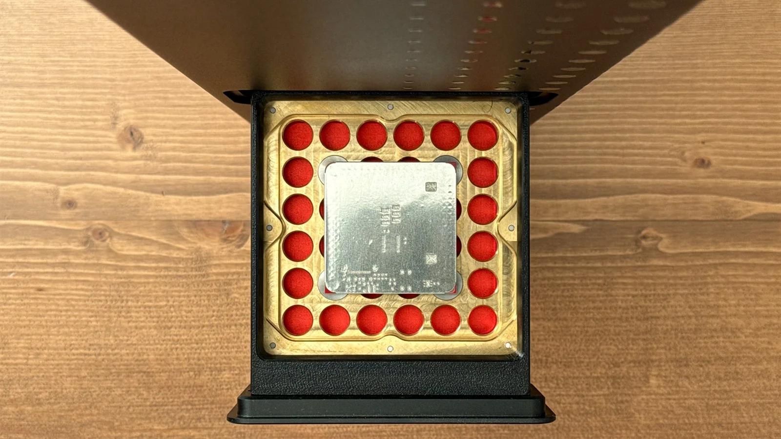 A solder-paste stencil cut directly over the fabricated PCB