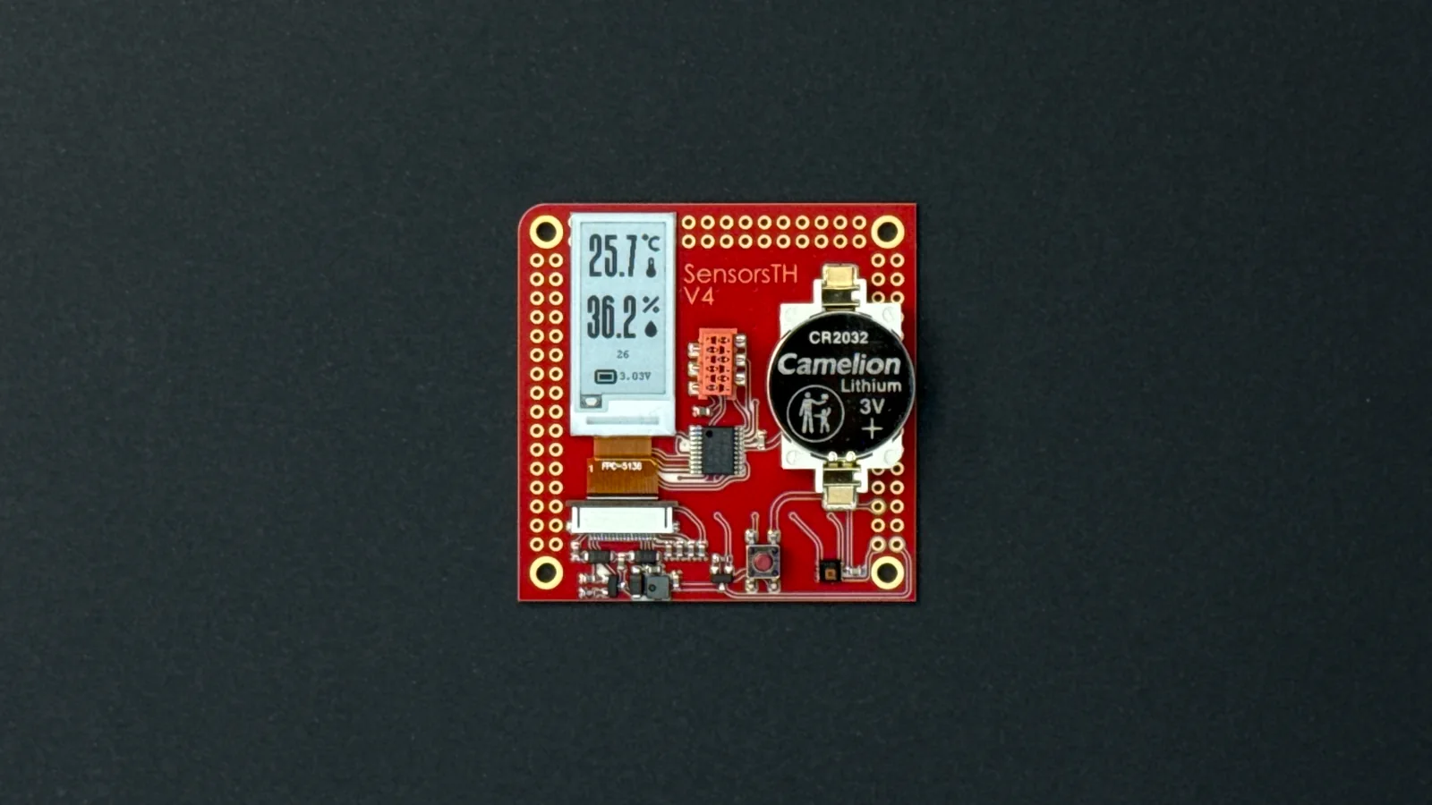 The finished benchmark weather station board running, with temperature and humidity on its e-ink display